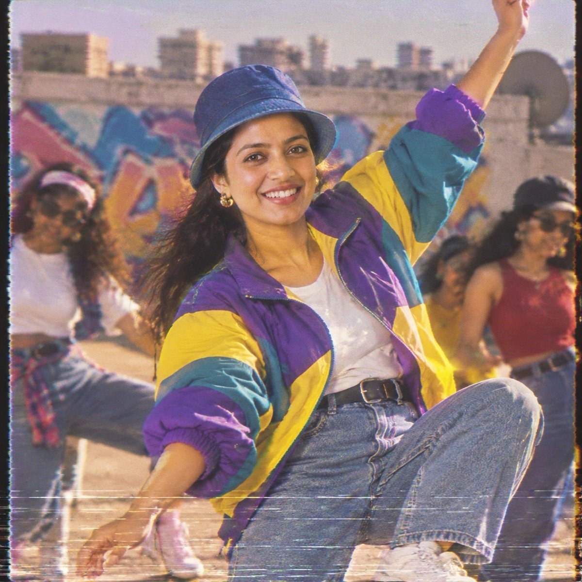 ChatGPT result for prompt 11: a woman in a colour-block windbreaker and bucket hat dancing on a rooftop, 1990s music-video style