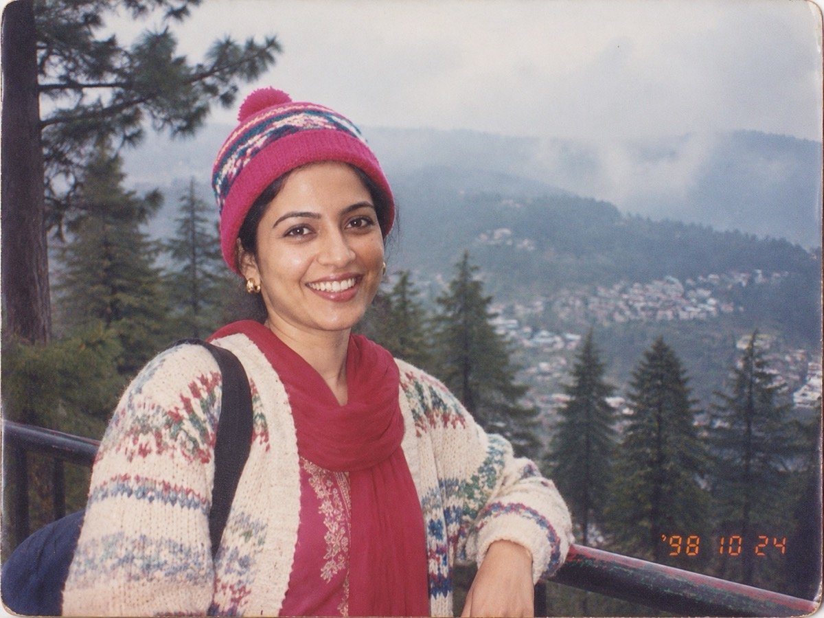 ChatGPT result: a 1990s hill-station snapshot of a woman in a woollen cap, with an orange 98 10 24 date stamp